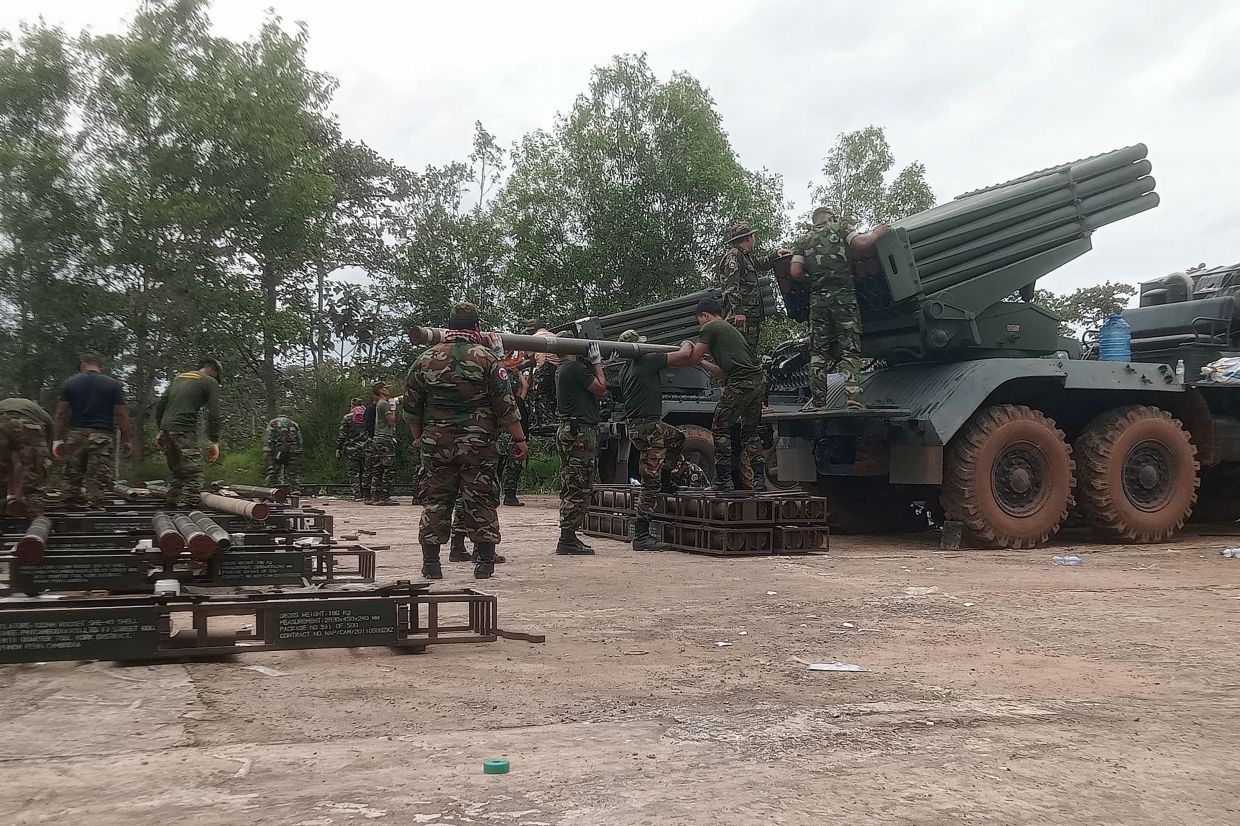 Cambodian soldiers reload the BM-21 multiple rocket launcher in Preah Vihear province on July 24, 2025. Thailand launched air strikes on Cambodian military targets on July 24 as Cambodia fired rockets and artillery, killing a civilian, in a dramatic escalation of a long-running border row between the two neighbours. -- Photo by AFP