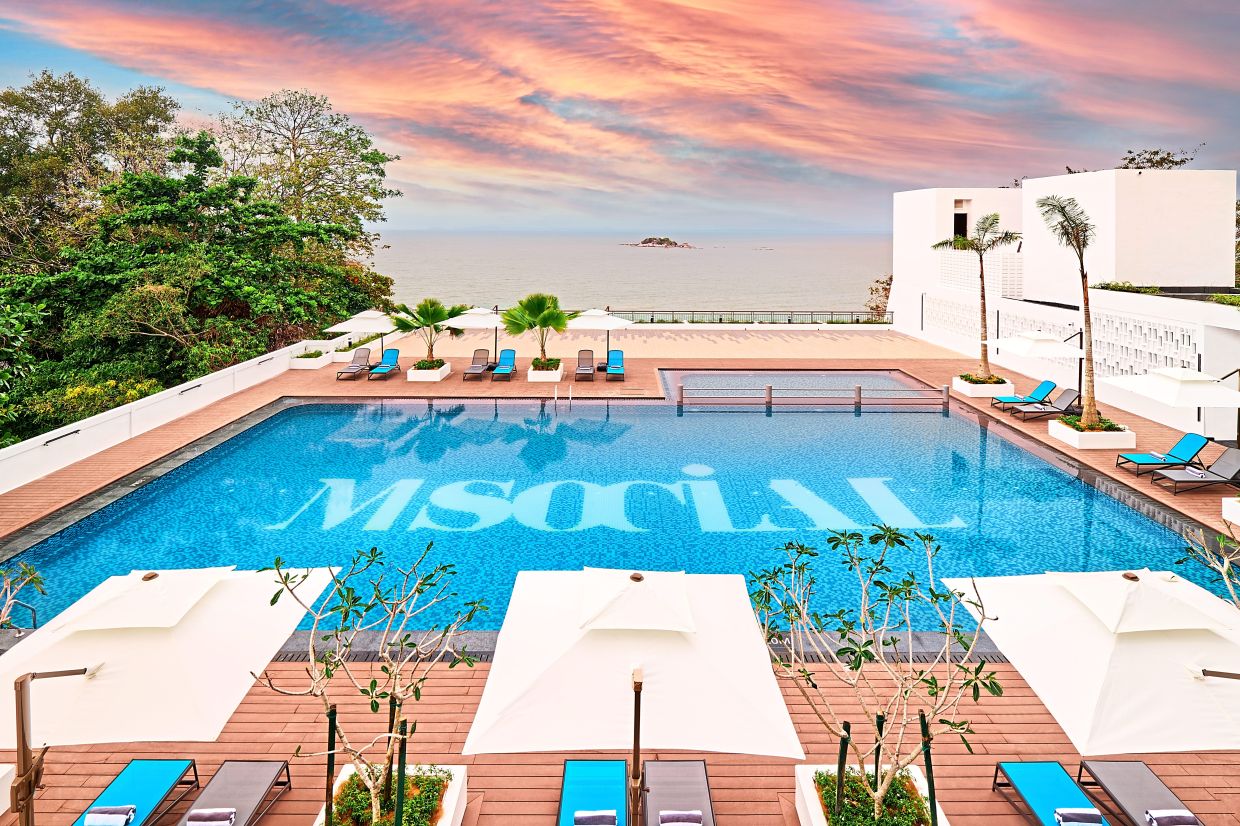 Guests can unwind by the resort’s scenic outdoor pool and soak in stunning sunset views.