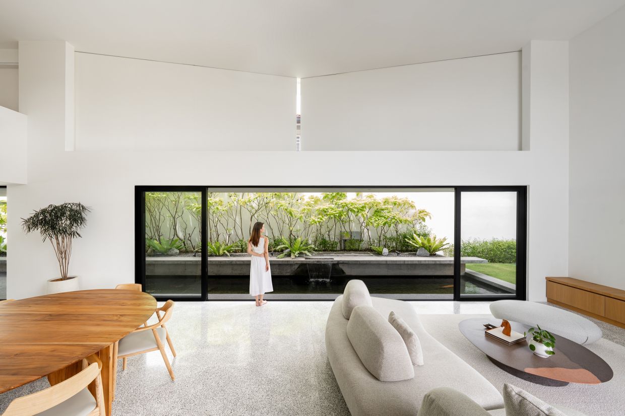 The star of the show is a two-panel pivoting wall above the sliding doors of the main living area.