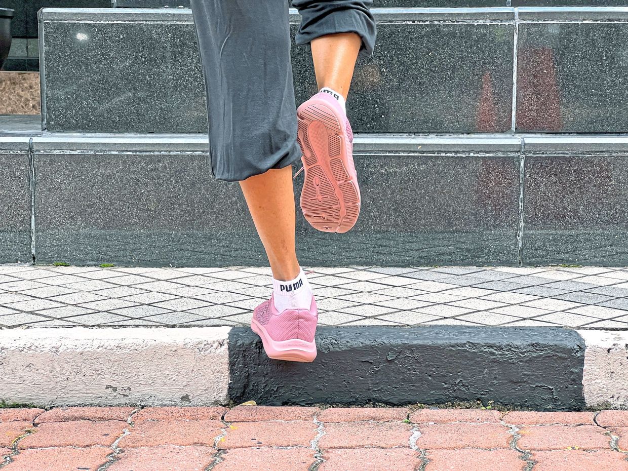 Gradually lower the heel over five or six seconds until it is below the step level. The slow lowering (eccentric phase) is crucial as this is where most of the strengthening occurs. Start with one set of 10 repetitions before switching legs. As your calves get stronger, you can increase the number of sets or add weight for additional resistance.
