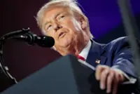 Trump signs order aimed at curbing big-money influence in college sports