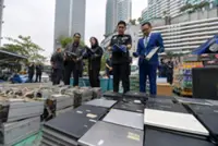 Cops dispose of more than RM720,000 worth of case items including fake cash, porn VCDs