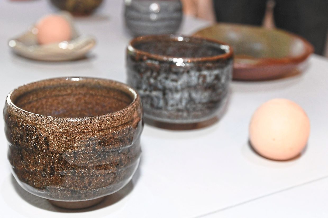 The artist’s ceramic bowls with ‘tenmoku glaze’. — Photos: ONG SOON HIN/The Star