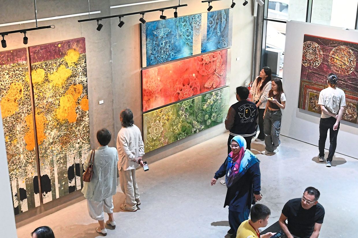 Art lovers attending the launch of ‘Tempering’ exhibition in Kuala Lumpur, which runs until Aug 2. — Photos: ONG SOON HIN/The Star