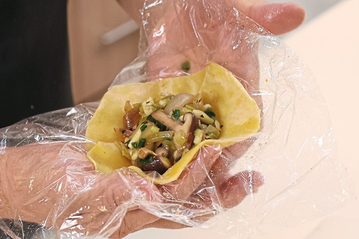 Stuff the pastry with filling and crimp the edges.