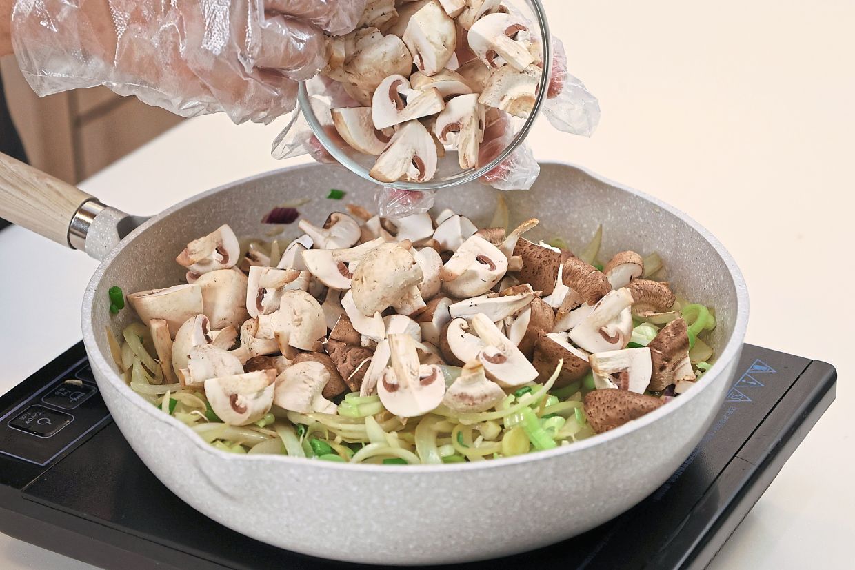 Quarter the mushrooms and sauté until wilted and tender.