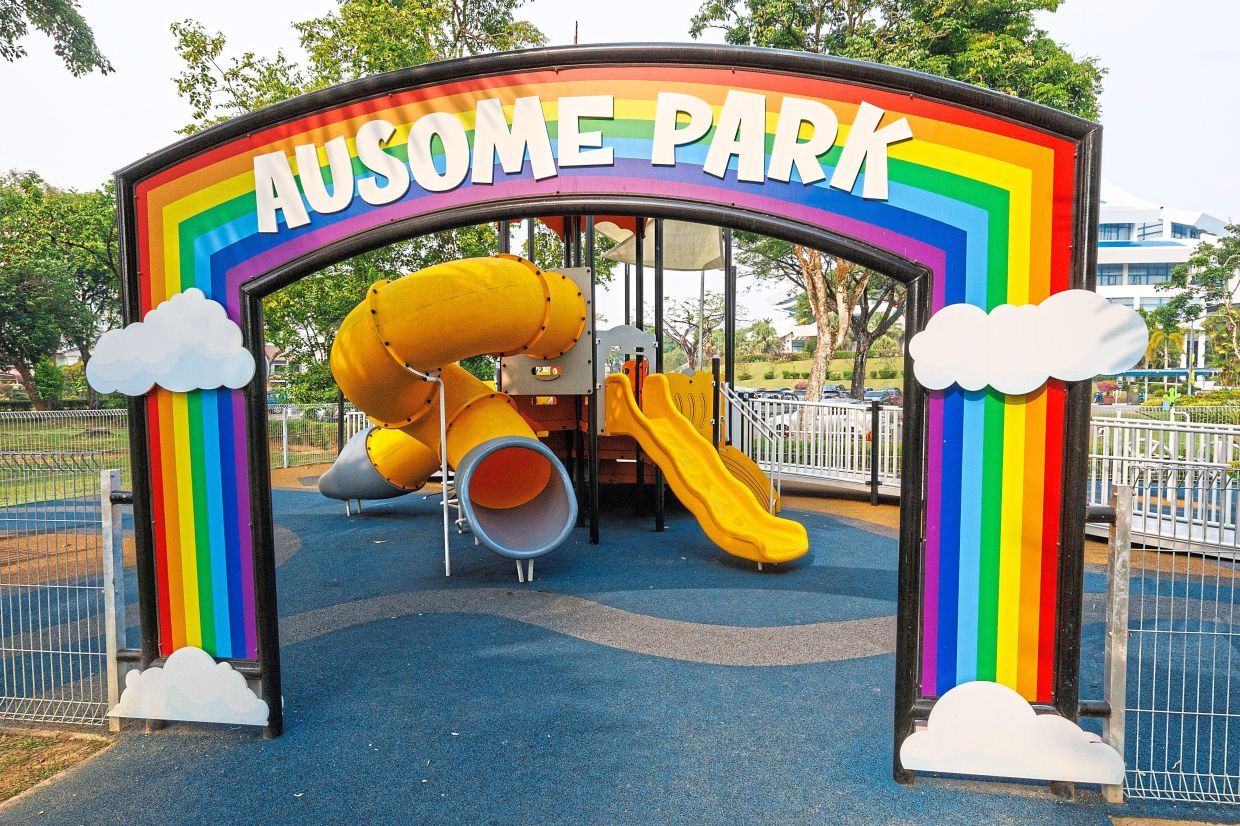 Kuching Autistic Association president Dr Catherine Chen trying out the xylophone at Ausome Park.– ZULAZHAR SHEBLEE / The Star