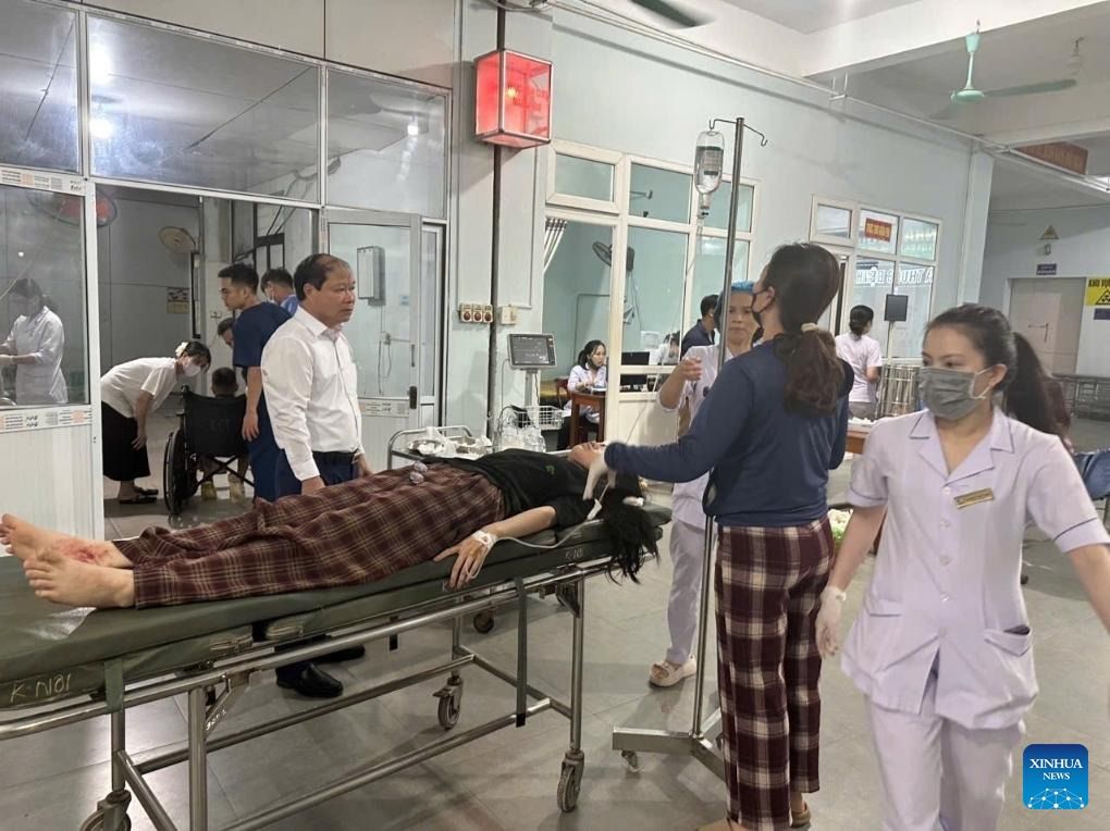 An injured woman receives treatment at a hospital in Vietnam's central province of Ha Tinh, July 25, 2025. - Photo: VNA/handout via Xinhua
