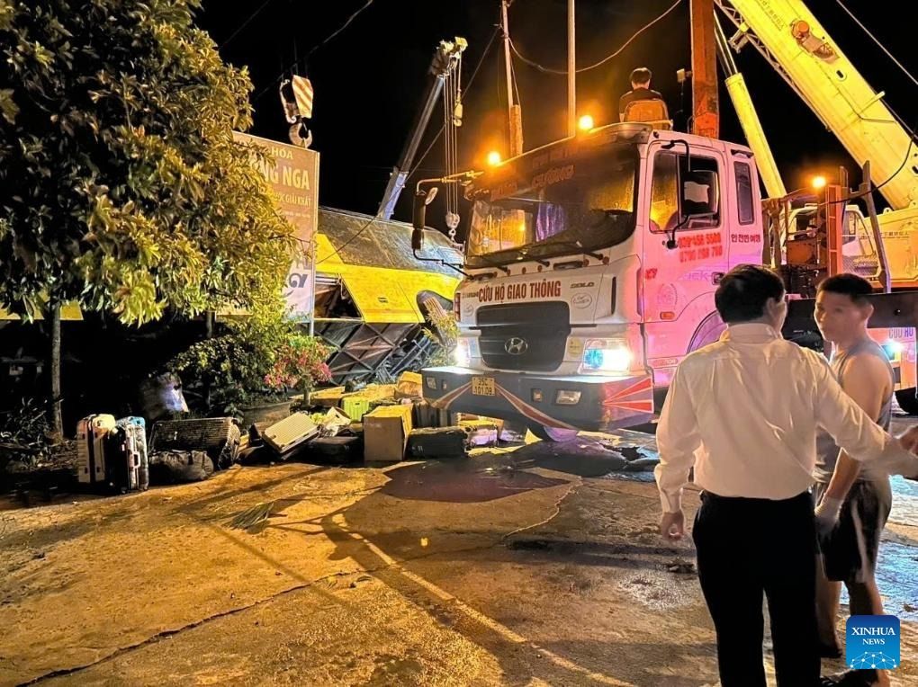 Rescuers work at the overturning site of a sleeper bus in Vietnam's central province of Ha Tinh, July 25, 2025. - Photo: VNA/handout via Xinhua