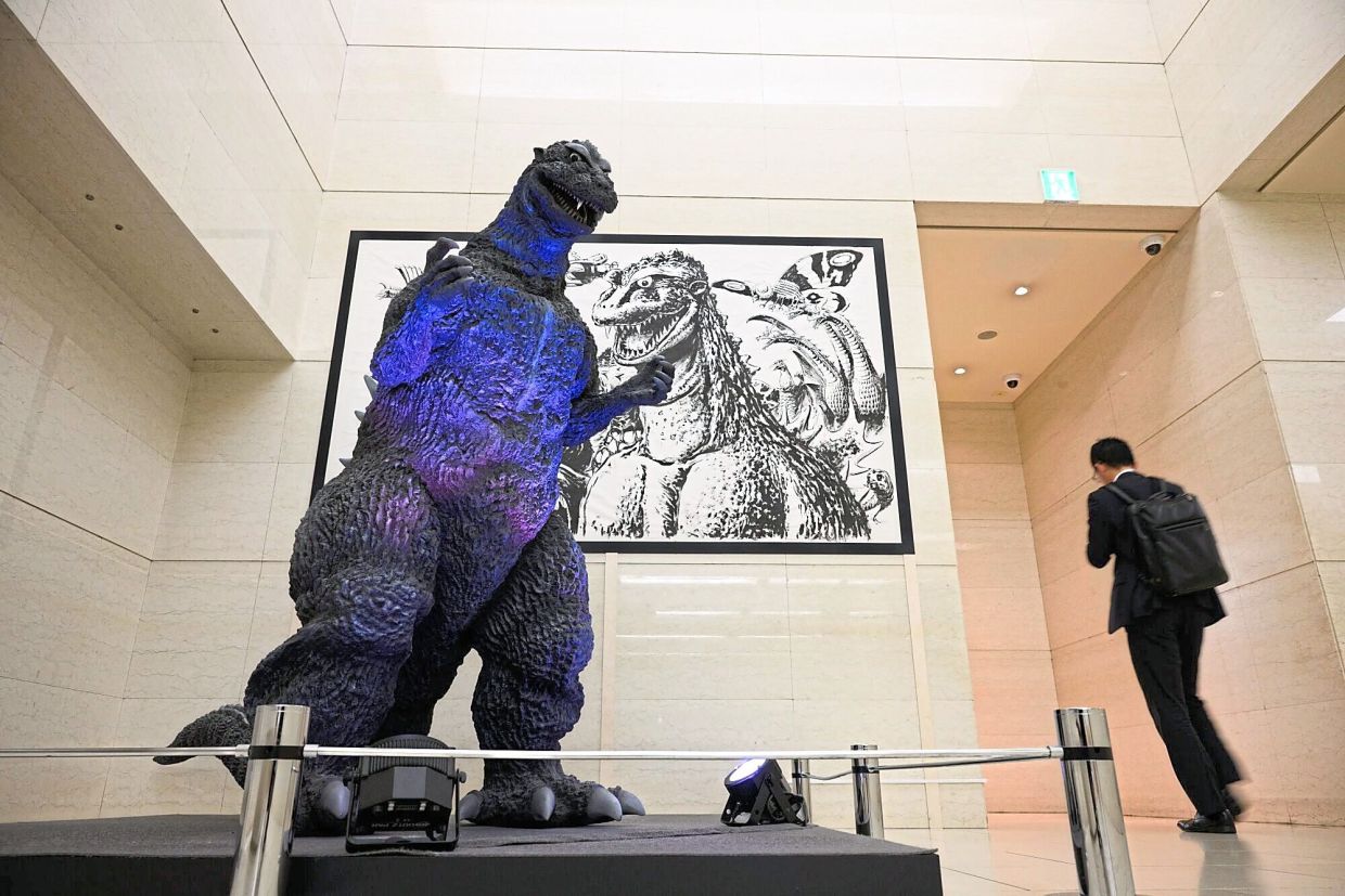 A statue of the Godzilla inside the Toho Studio head office building in Tokyo, Japan. — AKIO KON/Bloomberg