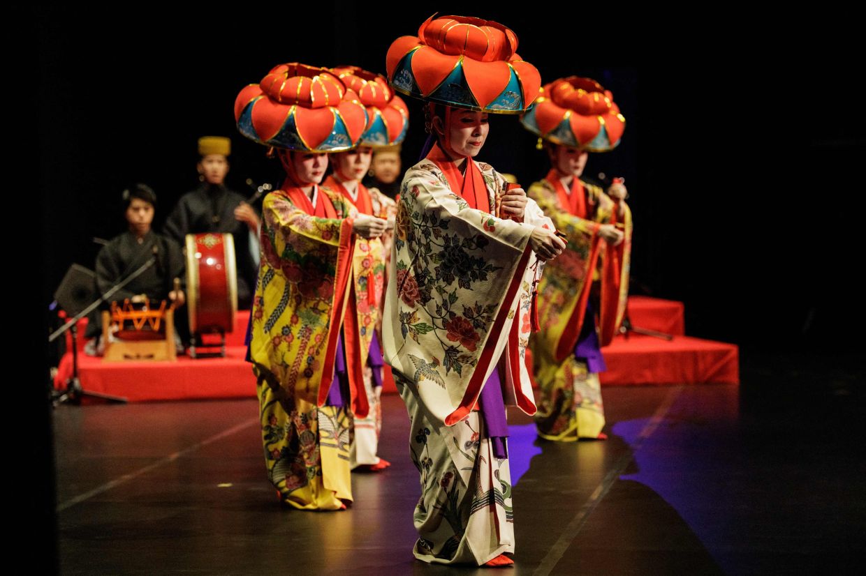 Japanese dancers perform Ryukyu Buyo, a traditional Okinawan dance blending graceful movements with vibrant music rooted in the heritage of the Ryukyu Islands, during a cultural exchange programme by the Japan Foundation at the Taman Ismail Marzuki (TIM) theatre in Jakarta. -- Photo by YASUYOSHI CHIBA / AFP