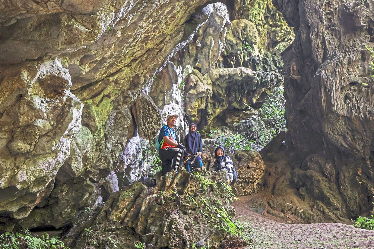 Visitors eager to explore the cave must first brave a 3m to 5km off-track journey through dense forest, steep climbs, and narrow passages – a physically and mentally demanding adventure. Photo: Bernama 