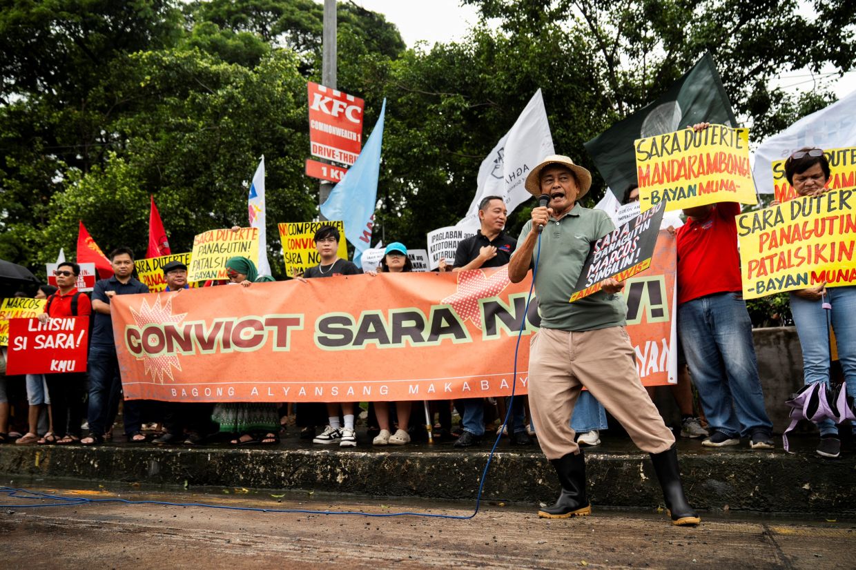 Protesters hold an indignation rally a day after the Supreme Court ruled the impeachment complaint against Philippine Vice President Sara Duterte unconstitutional, in Quezon City, Metro Manila, Philippines. -- Photo: REUTERS/Lisa Marie David