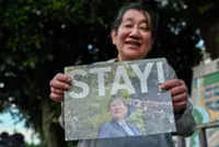 Japan PM Ishiba signals intent to stay on despite calls to quit