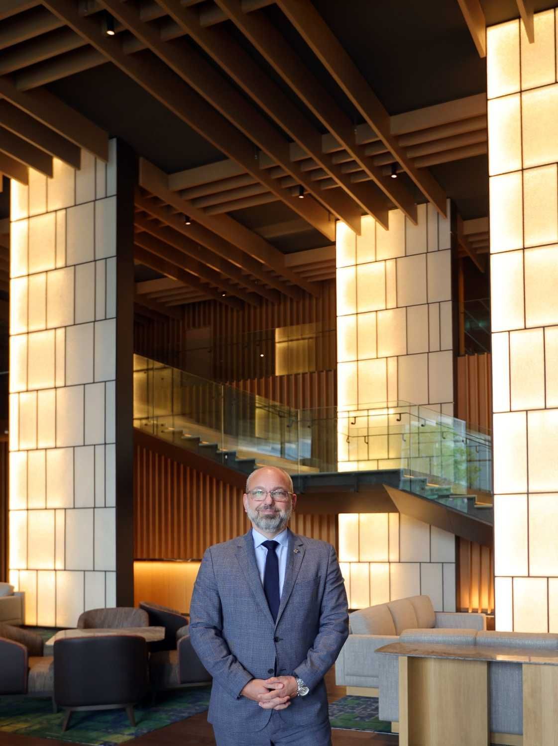 Hyatt Regency Kuala Lumpur at KL Midtowngeneral manager Till Martin stands at the one-of-a-kind hotel lobby designed by renowned Japanese architect Kengo Kuma. — CHAN TAK KONG/The Star