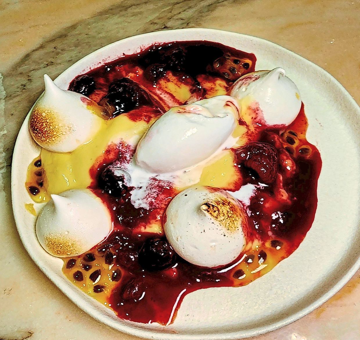 The vegan pavlova is fresh and fruity with a tropical underbelly. — ABIRAMI DURAI/The Star