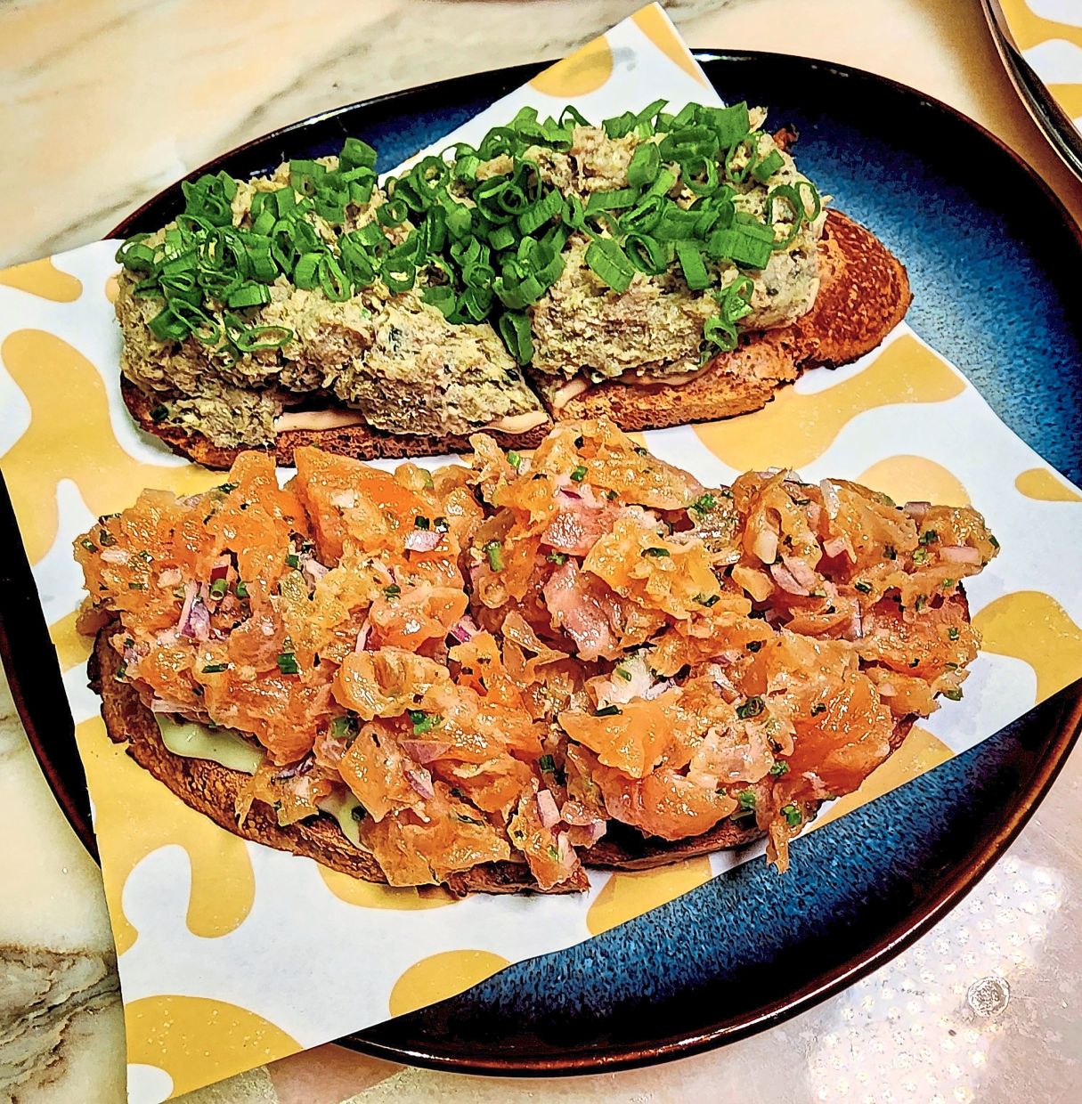 The surf and turf crostino serves up both trout (bottom) and duck. — ABIRAMI DURAI/The Star