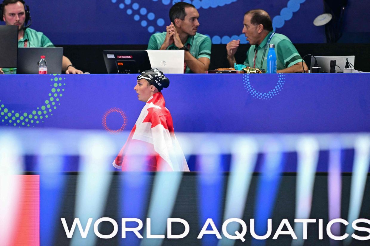 Canada's swimmer Summer Mcintosh reacts after winning the women's 200m individual medley swimming event during the 2025 World Aquatics Championships in Singapore on Monday, July 28, 2025. --Photo by MANAN VATSYAYANA / AFP