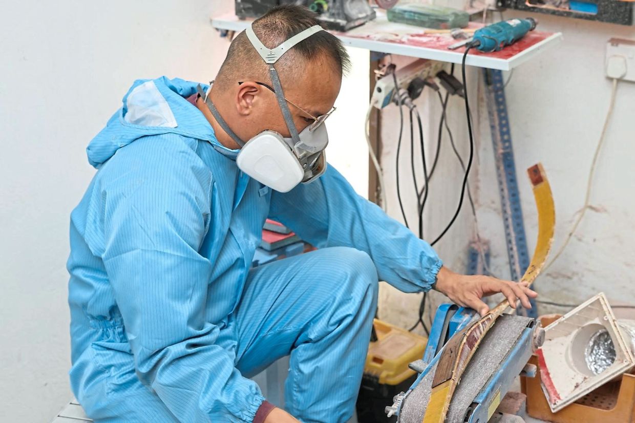 Wong dressed in protective gear during the stock removal process.