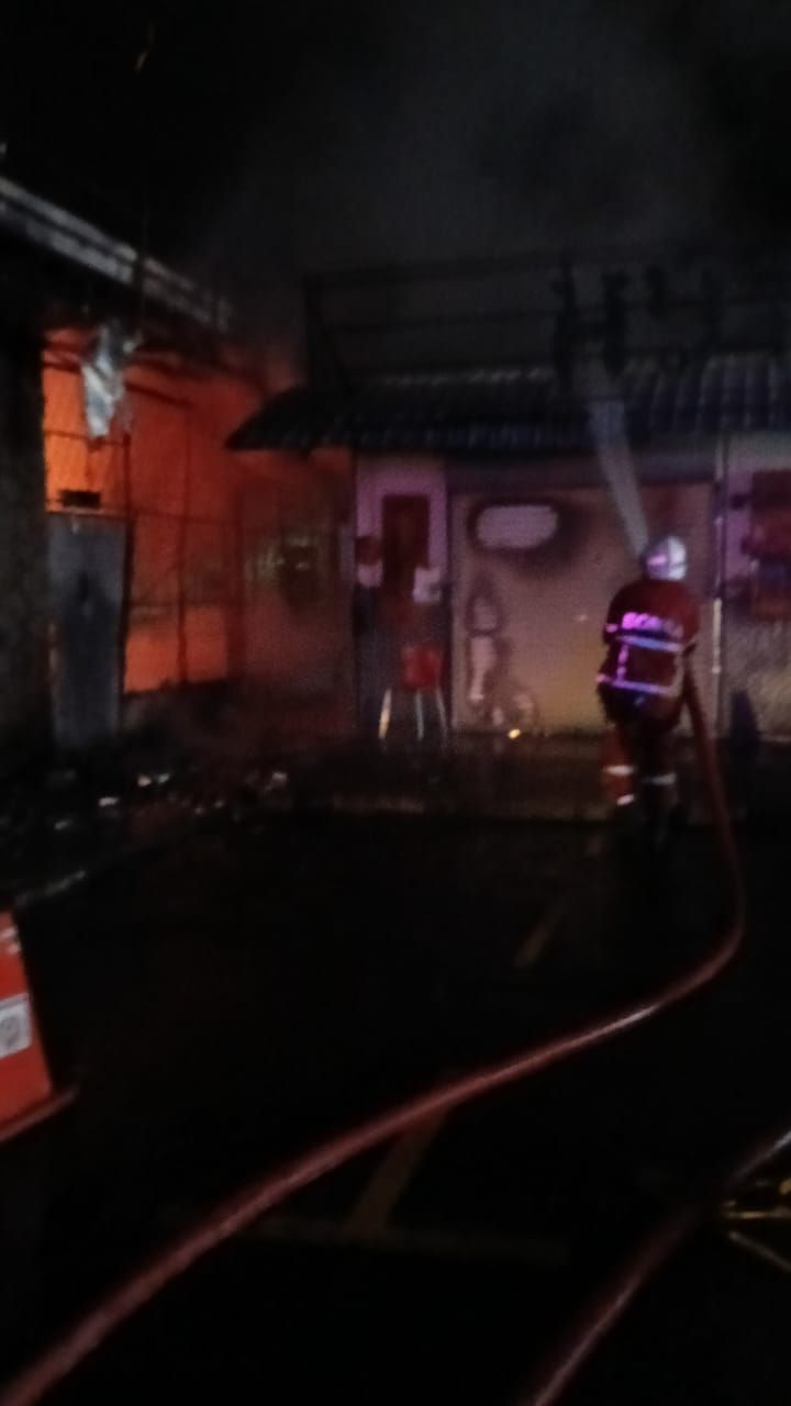 Firemen putting out the fire inside the Kota Kinabalu Community Hall.