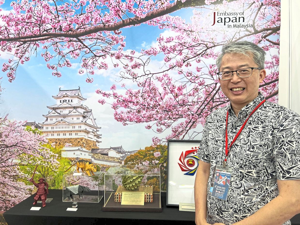 Ch’ng with some of the Malaysian-inspired origami on display.