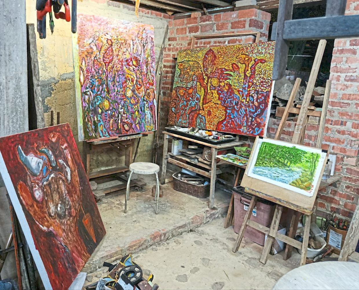 The ground floor of the house has been turned into a studio, showcasing some of Zainal’s paintings.
