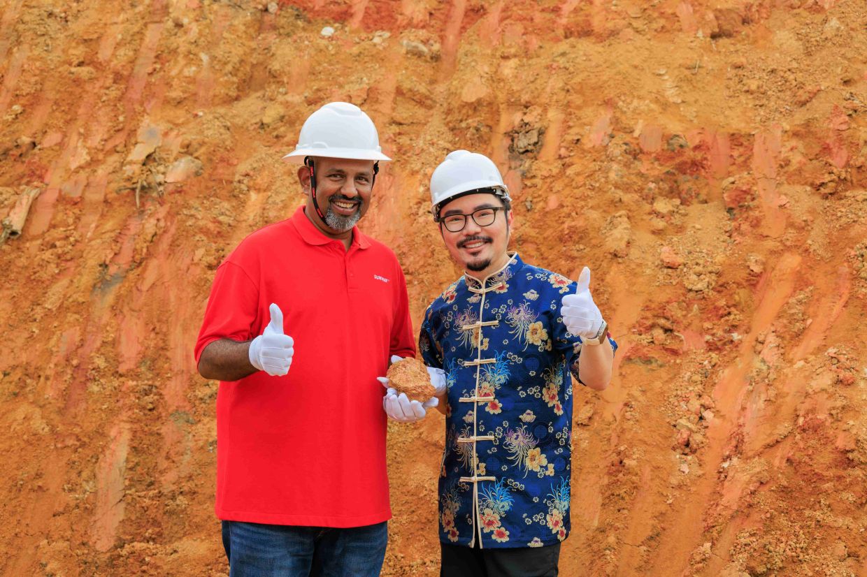 Gerard and Master Louis Loh posing together at the Sunway LakeHills site, where the towers are strategically positioned to embrace a spacious, unobstructed Bright Hall, a key feng shui feature symbolising the gathering of Qi, financial prosperity and open pathways to opportunity.