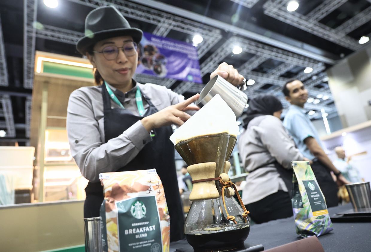 Visitors visiting the booth during the Malaysian International Food and Beverage Trade Fair (MIFB) at Kuala Lumpur Convention Centre on July 30.-AZMAN GHANI/The Star