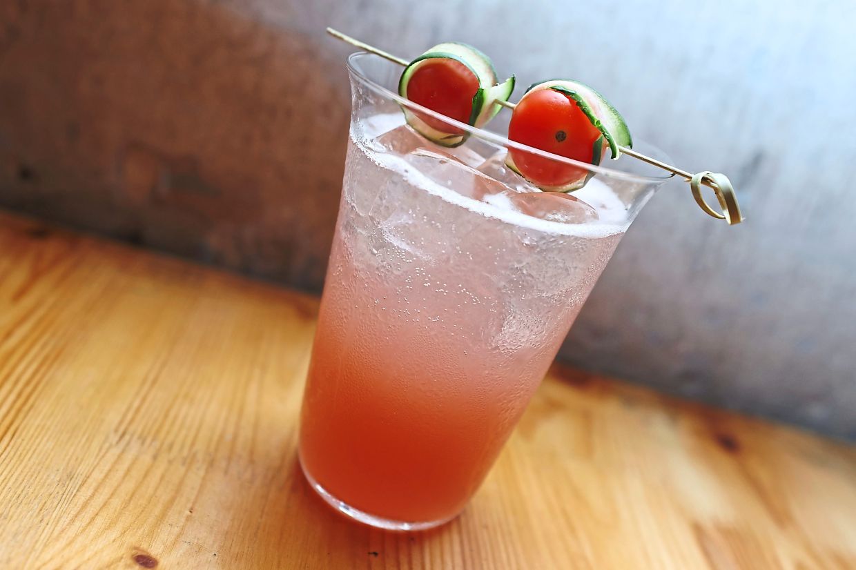 The Ginza Garden cocktail is a combination of gin, cherry tomatoes, cucumber, cranberry, lime and soda.