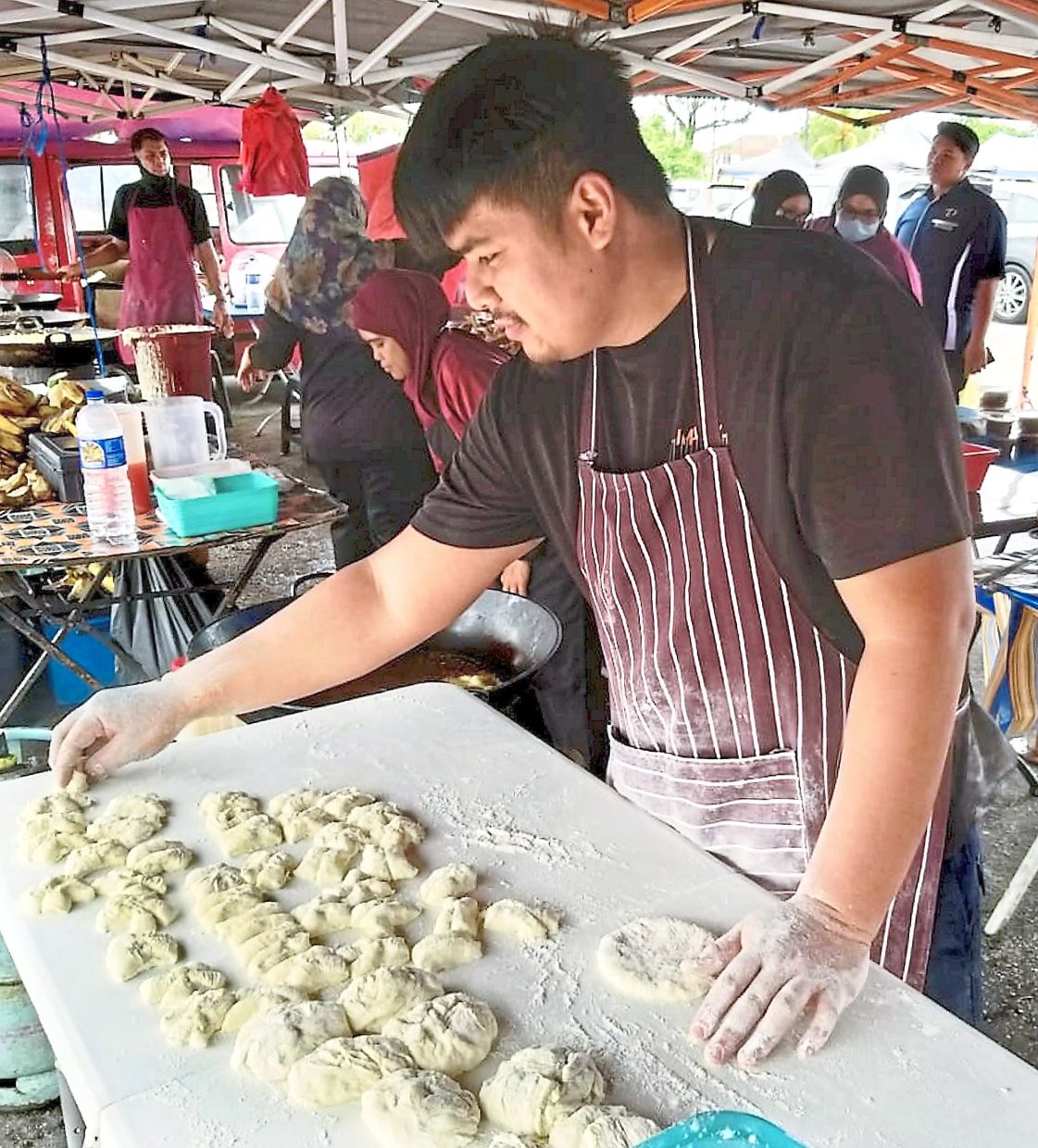 Abdul Halim says he has to set up at 4.30am despite only opening his stall five hours later.