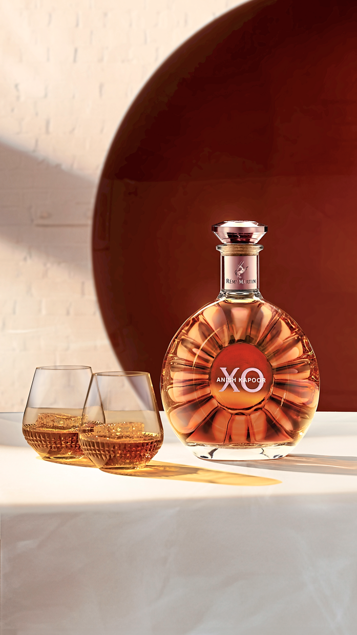 Kapoor reimagined it as a minimalist curve with a concave centre in glowing amber tones.