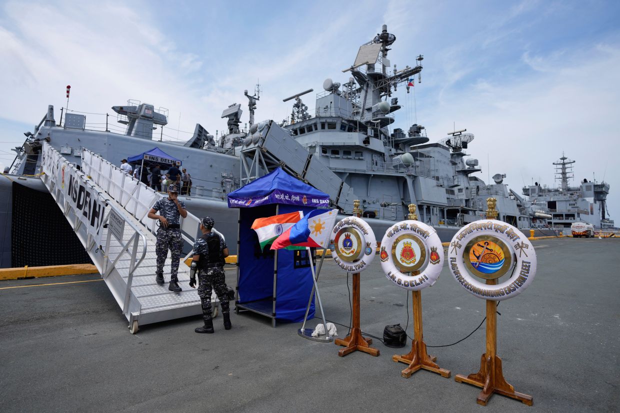 A crew disembarks the Indian Navy ship guided-missile destroyer, INS Delhi, that is docked at Manila's port, Philippines, on Friday, Aug. 1, 2025. -- AP Photo/Aaron Favila