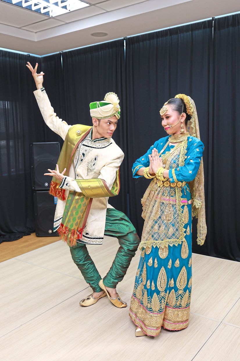 Siti Aishah Mustapa Kamal, 25 and Nor Muhammad Hijjahie Nor Hafizi, 21, dancers from Kuala Lumpur City Hall’s cultural troupe rehearse in full Indian costume, presenting classical movements that celebrate Malaysia’s Indian heritage through dance and dress.