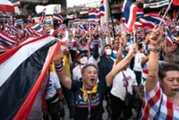 Protesters in Bangkok demand resignation of court-suspended prime minister following deadly conflict