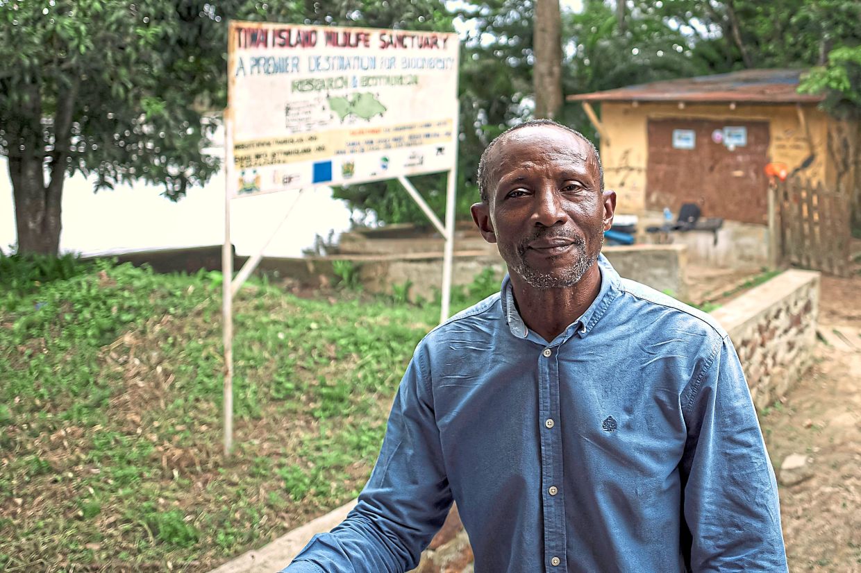 Garnett at the entrance of Tiwai Island Wildlife Sanctuary located on Tiwai Island. He has dedicated his life to environmental protection projects in West Africa, especially in Sierra Leone and Liberia. — Photos: SAIDU BAH/AFP