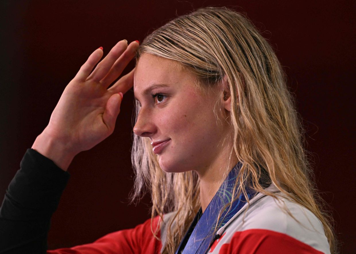 Canada's swimmer Summer McIntosh speaks to the press after the swimming event during the 2025 World Aquatics Championships in Singapore on Sunday, August 3, 2025. -- Photo by Oli SCARFF / AFP