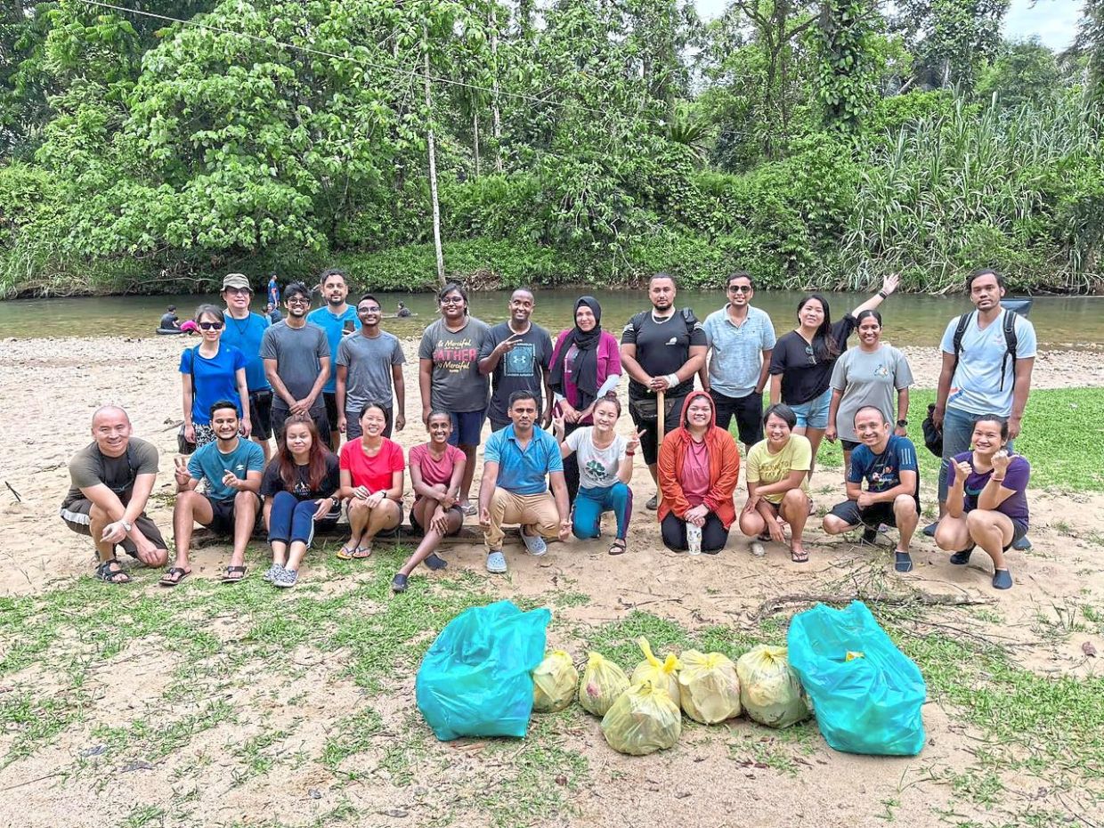 In 2022, Bavanie (seated, fifth from left) joined Cava and organised hiking and camping trips along with clean-ups. Photo: Cava