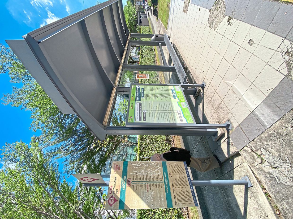 The bus stop outside Institut Latihan DBKL along Jalan Yaacob Latif with both GoKL and Rapid KL bus routes displayed.