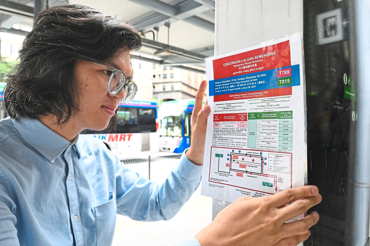 Ernest has taken the initiative to paste posters at bus stops to inform the public about bus service changes.