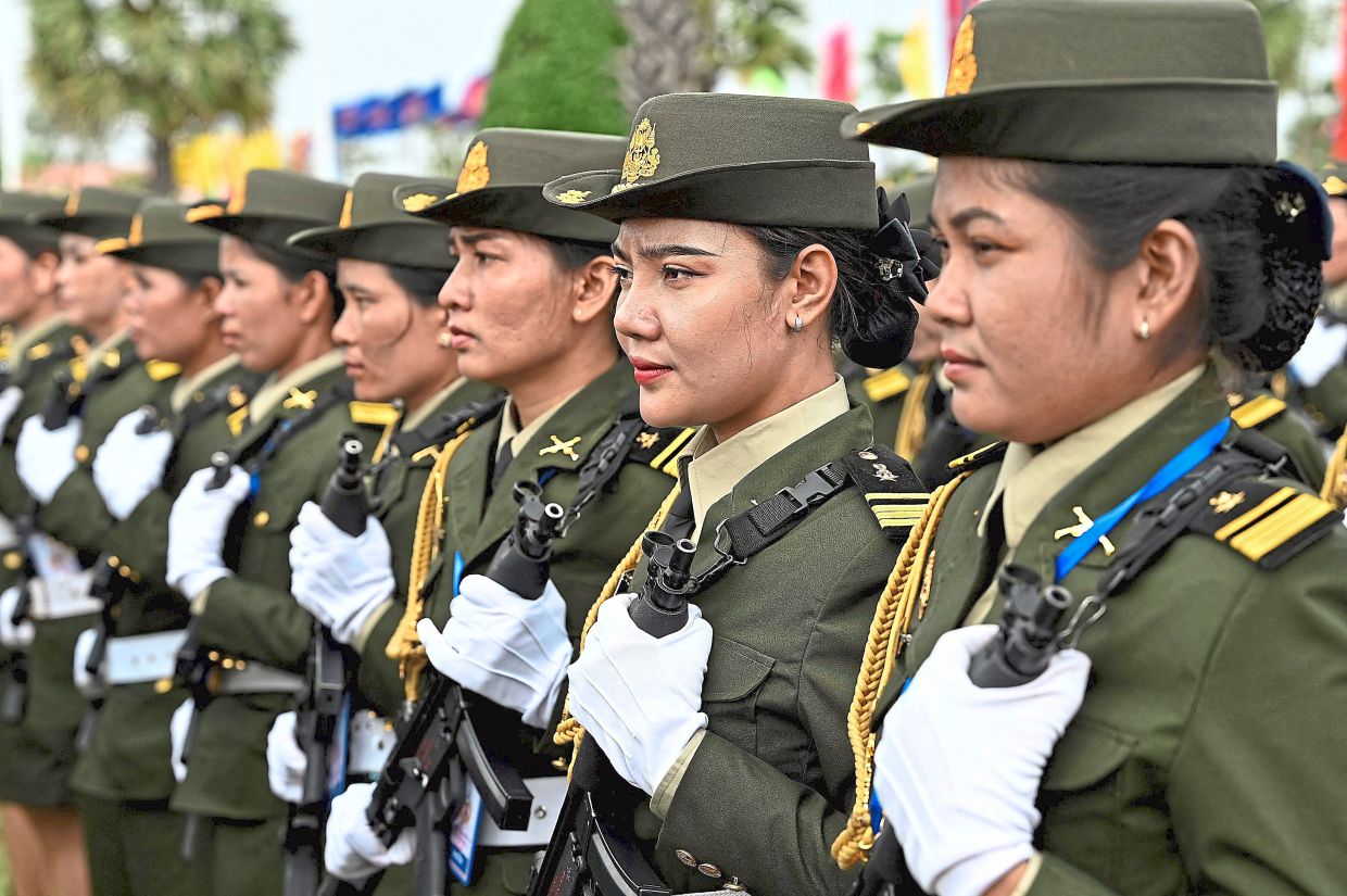 At the ready:A file photo of soldiers standing in formation during a ceremony marking the 25th anniversary of the formation of the Royal Cambodian Army in Phnom Penh on Jan 24, 2024. Hun Manet has said Cambodia’s conscription law will be used to replace retiring troops, though it is unclear how many citizens are set to be called up. — AFP