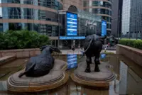 Asian markets fluctuate as traders weigh tariffs, US jobs
