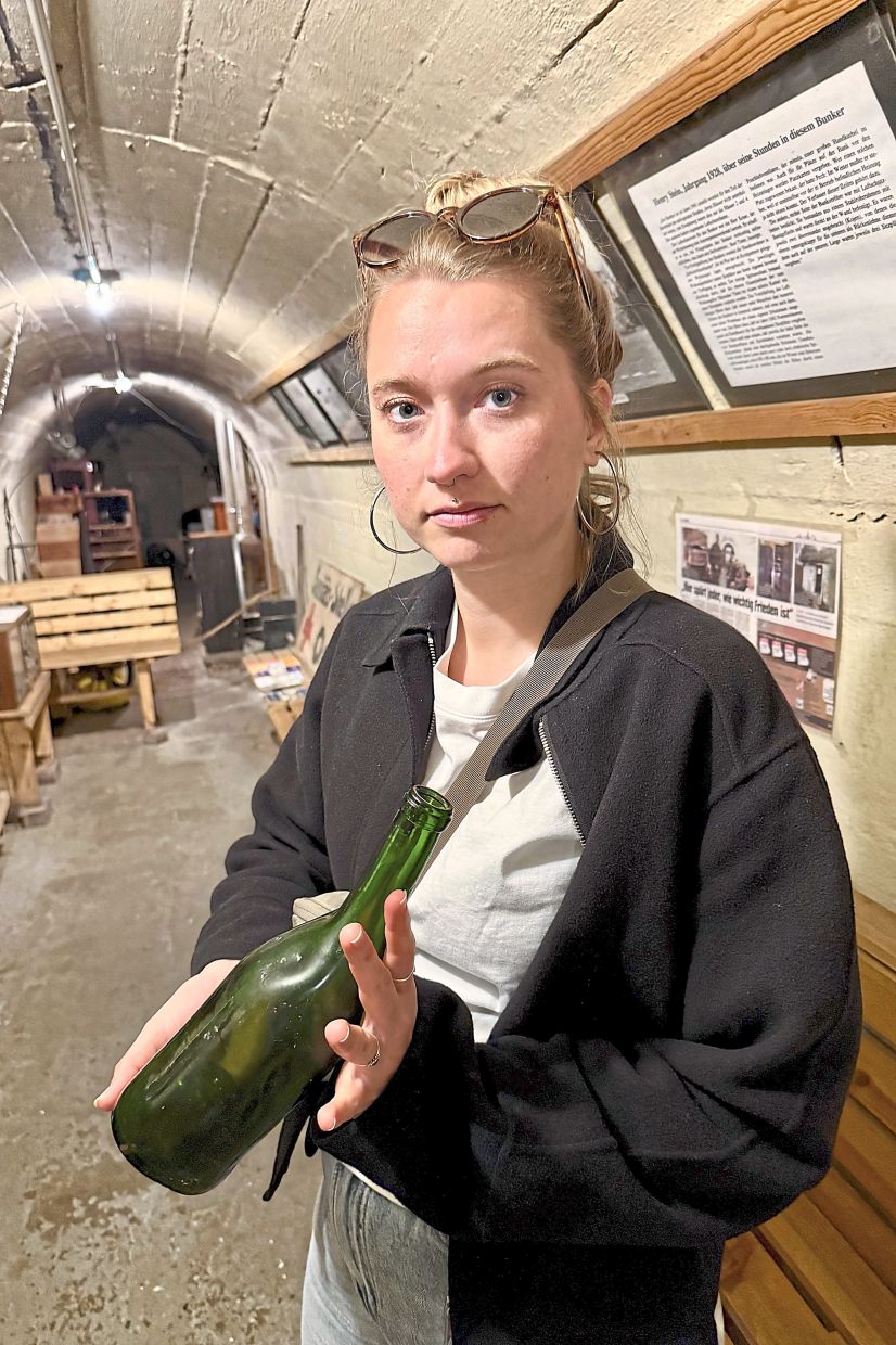 Kanne showing visitors to the bunker the remains of a melted gas canister.