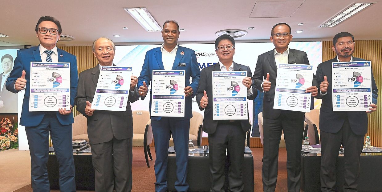 Good progress: (From left) Rizal, Bernard, Ramanan, Ewon, Khairul Dzaimee and Mohd Uzir holding fact sheets of the ‘Prestasi PMKS 2024’ report at the announcement ceremony. — AZHAR MAHFOF/The Star