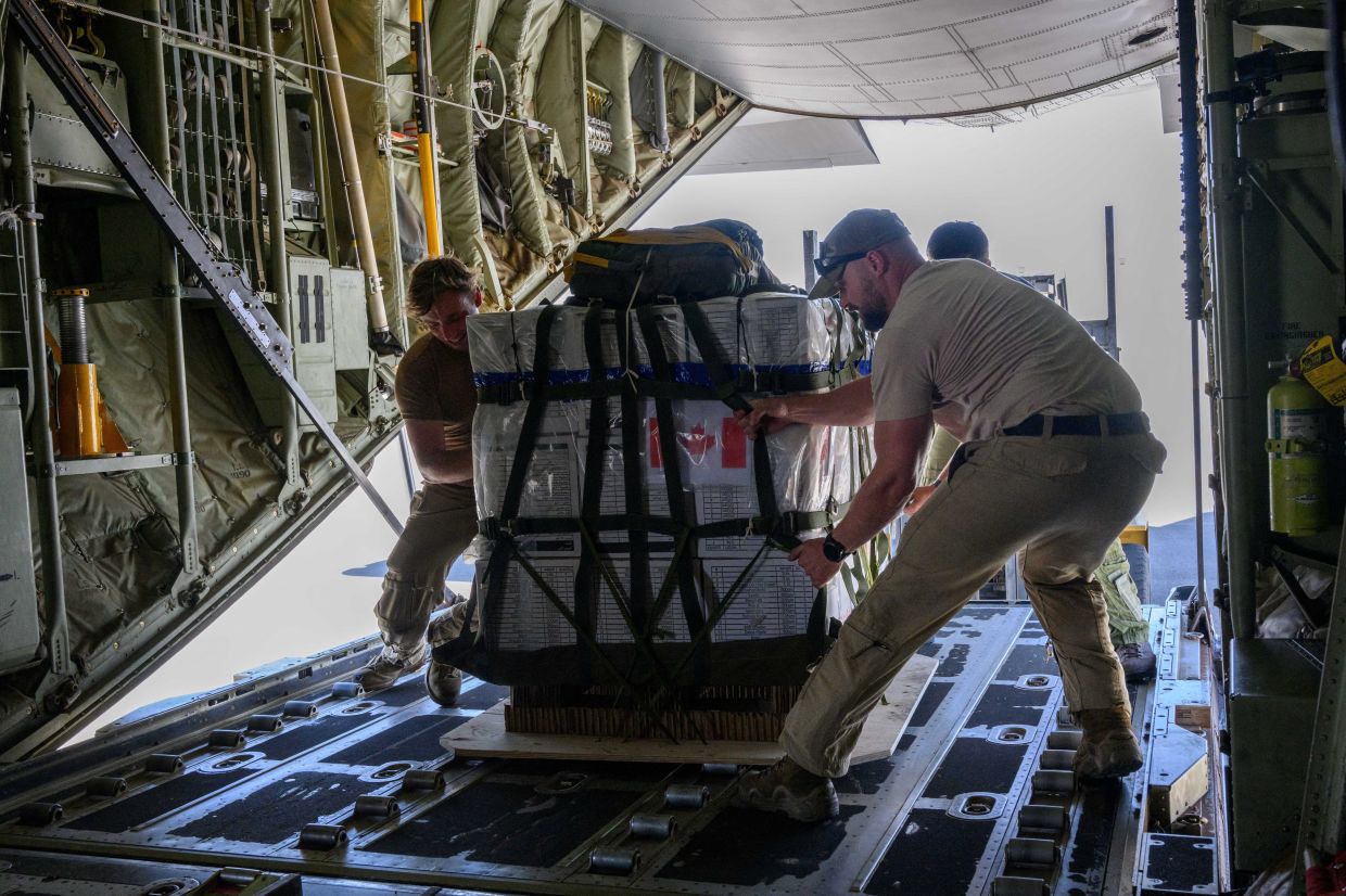Canadian armed forces airdrop 10 tonnes of aid into Gaza