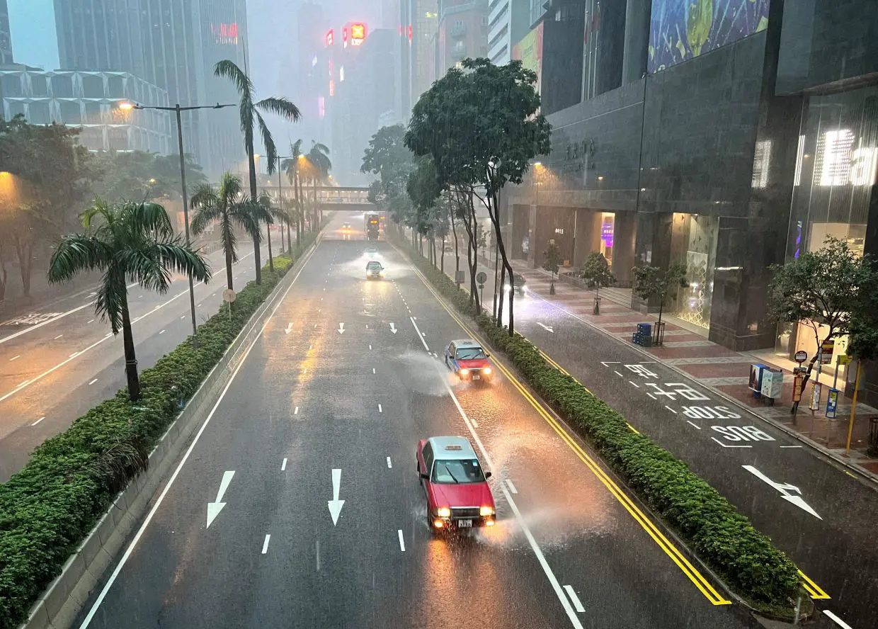 Hong Kong issues highest weather warning, as rains shut schools, courts and  hospital wards | The Star