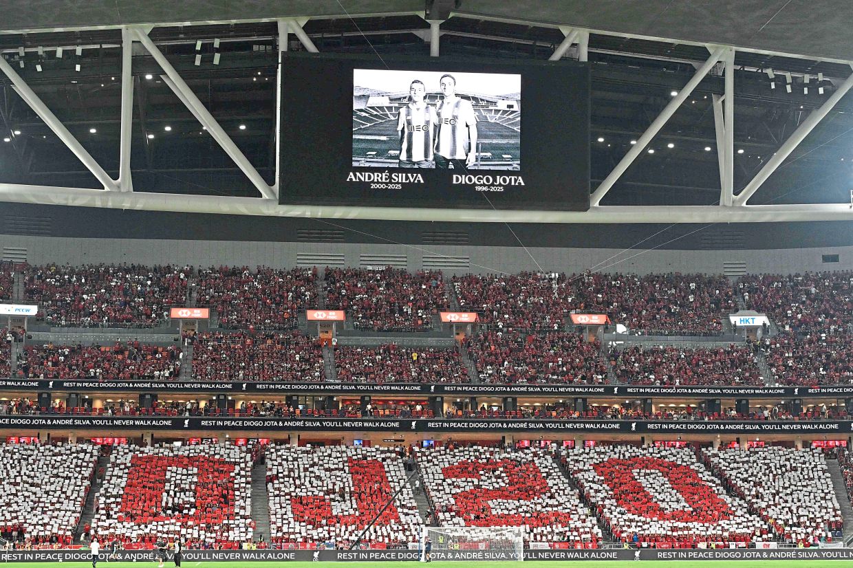 A tribute to the late Liverpool player Jota and his brother Andre Silva was shown before the exhibition match between the Premier League champions and AC Milan at new Kai Tak Stadium in Hong Kong on July 26. – AFP