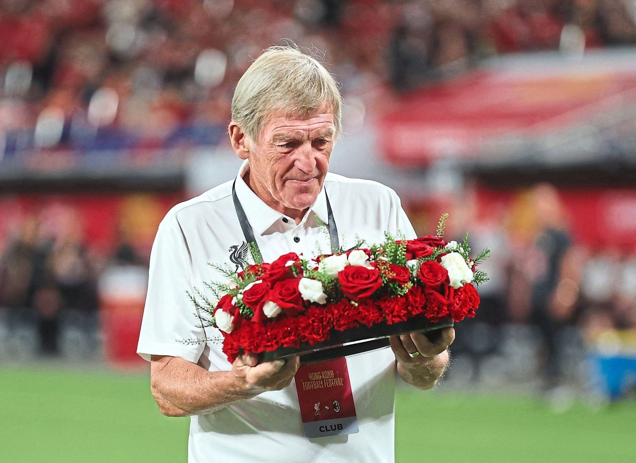 Former Liverpool player and manager Kenny Dalglish laid a wreath on the pitch in tribute to Diogo Jota before the match and also opened the Liverpool megastore in Kai Tak Mall. — Reuters