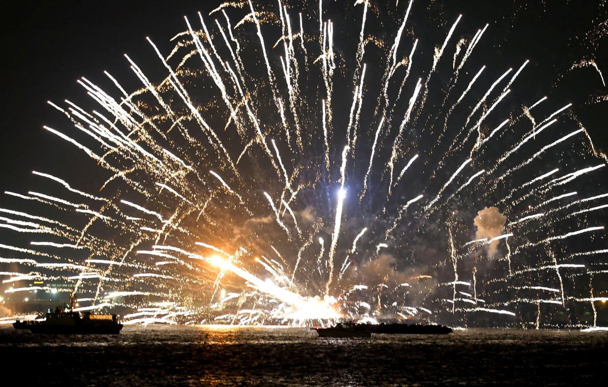 Fireworks beinge launched from a burning barge during the Minato Mirai Smart Festival, a fireworks festival, in Yokohama, south of Tokyo on Aug 4, 2025. - Kyodo via Reuters