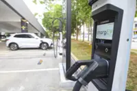 INTERACTIVE: EV boom highlights charging bay shortage