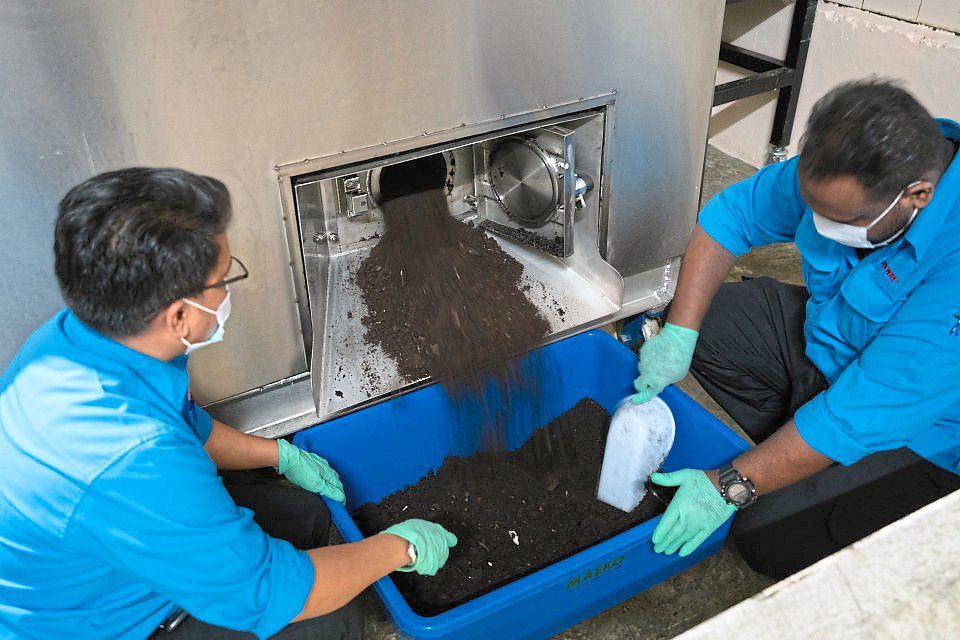 Staff working the ‘food digester’ at the recycling centre in a Sunway mall to help F&B tenants with the large amount of food waste they generate. The machine will give the waste new life as compost, which is then packed and left for the public to pick up – for free – at designated spots. — Sunway Malls